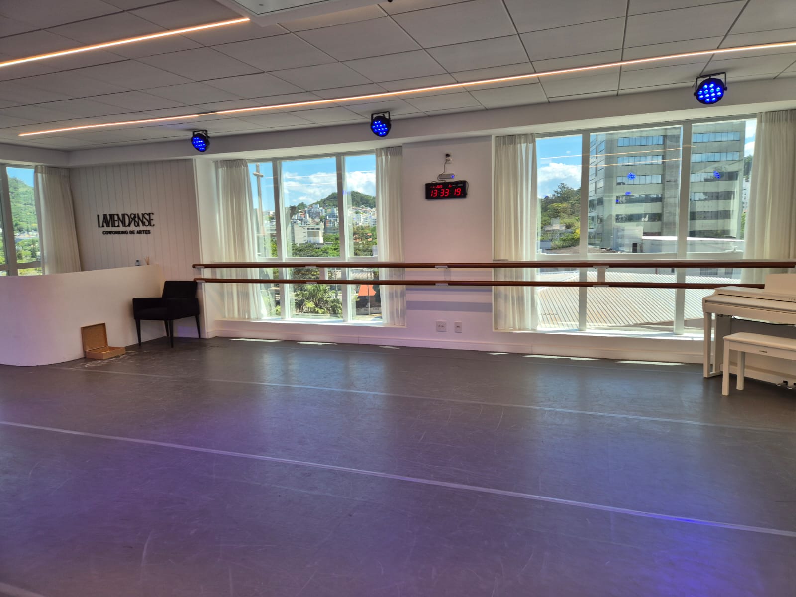 Spacious ballet studio with large mirrors and natural light